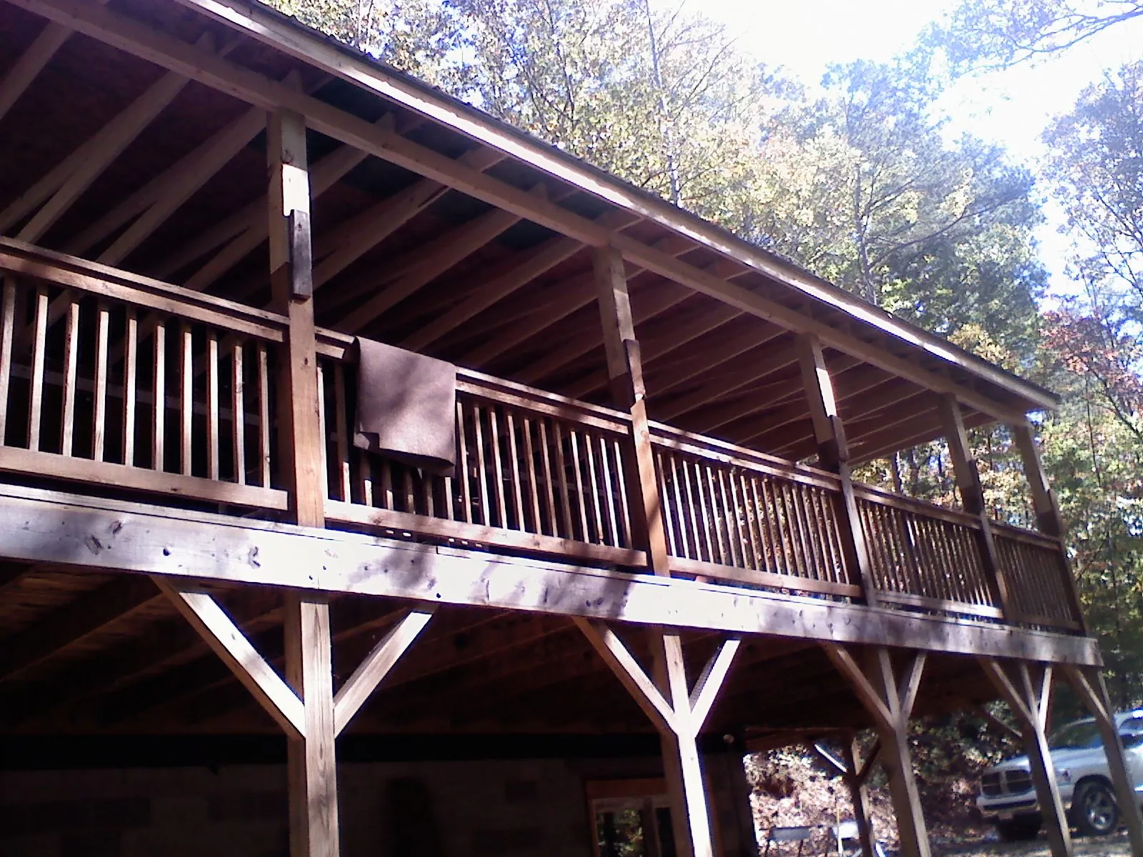 Timber framing under a new elevated porch and deck — Roof Leak Repair in New Canton by Roofing Brothers